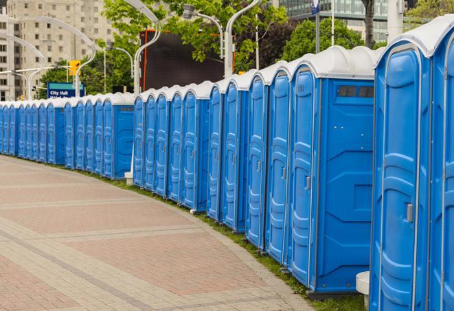 a line of portable restrooms at a sporting event, providing athletes and spectators with clean and accessible facilities in Forestdale AL